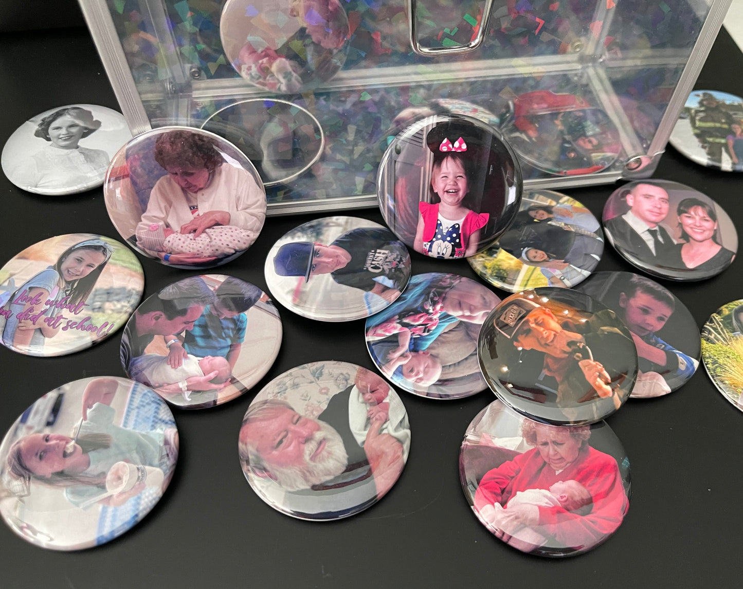 Collection of round photo coasters with various images on a dark surface.
