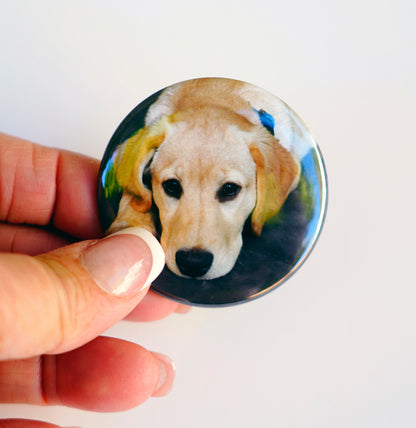 2-inch circle photo magnet shown in hand for size reference