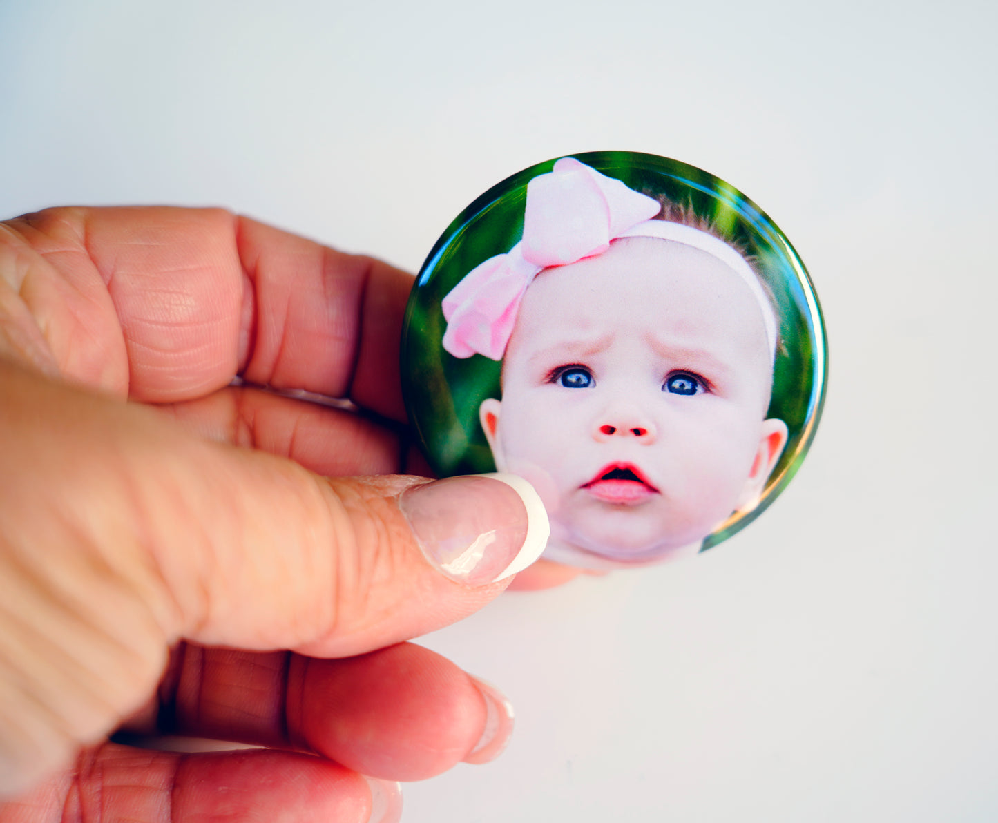 Example 2-inch circle photo magnet featuring baby portrait