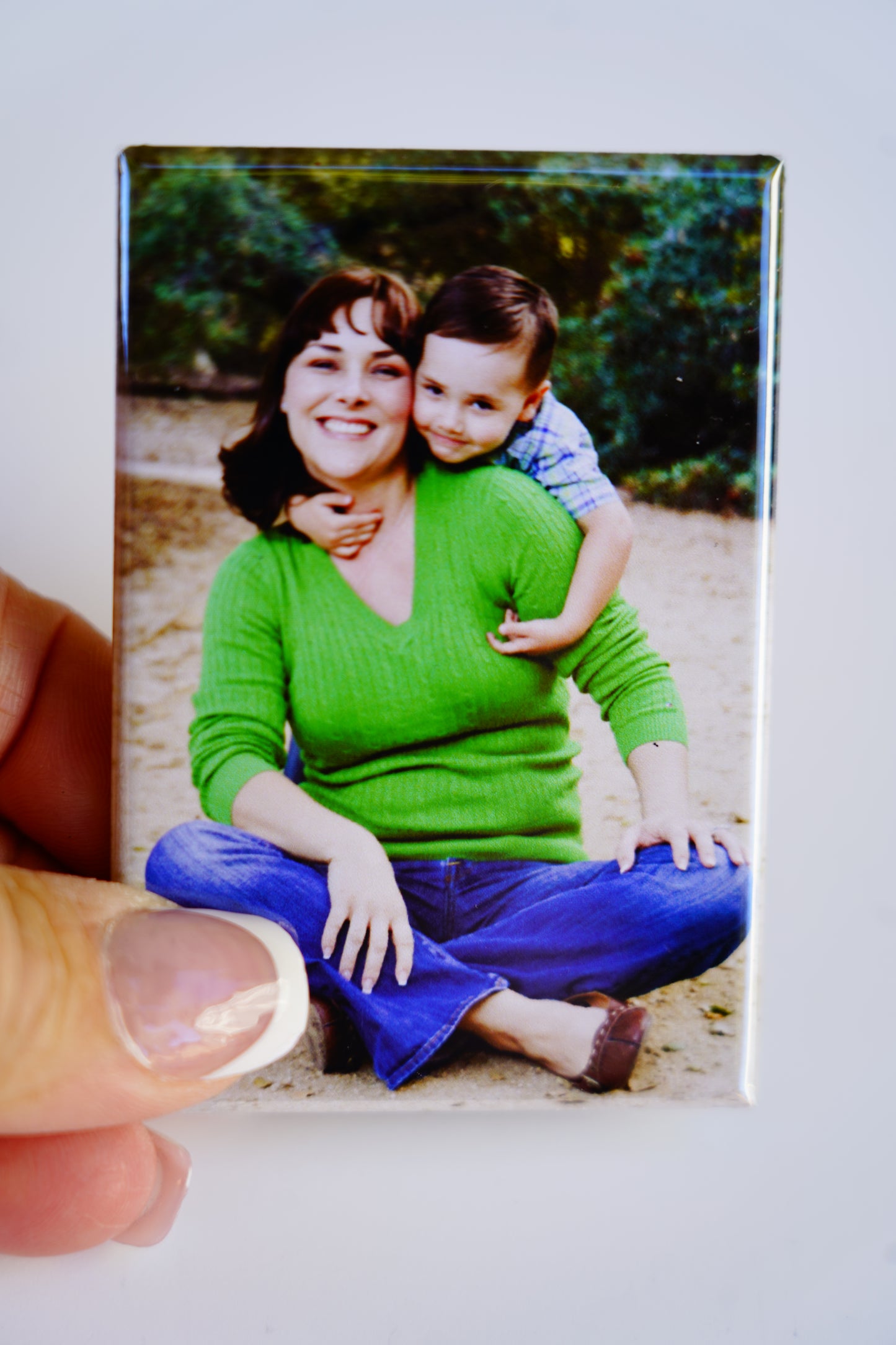 Hand holding custom 2×3 rectangle magnet – size reference