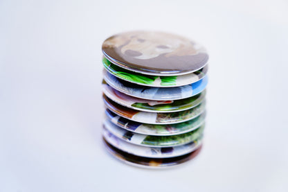 Stack of custom 2-inch circle photo magnets – premium printed finish