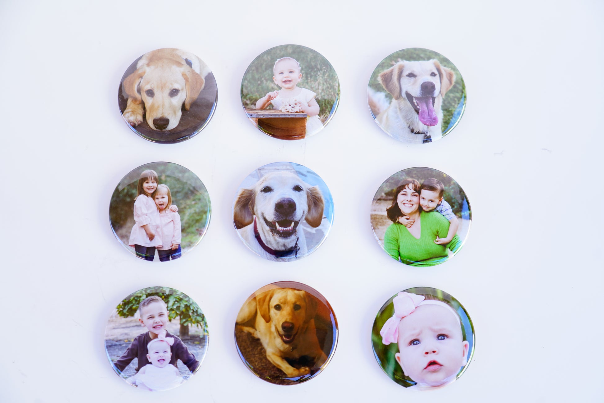 Collection of custom 2-inch circle photo magnets with assorted photos