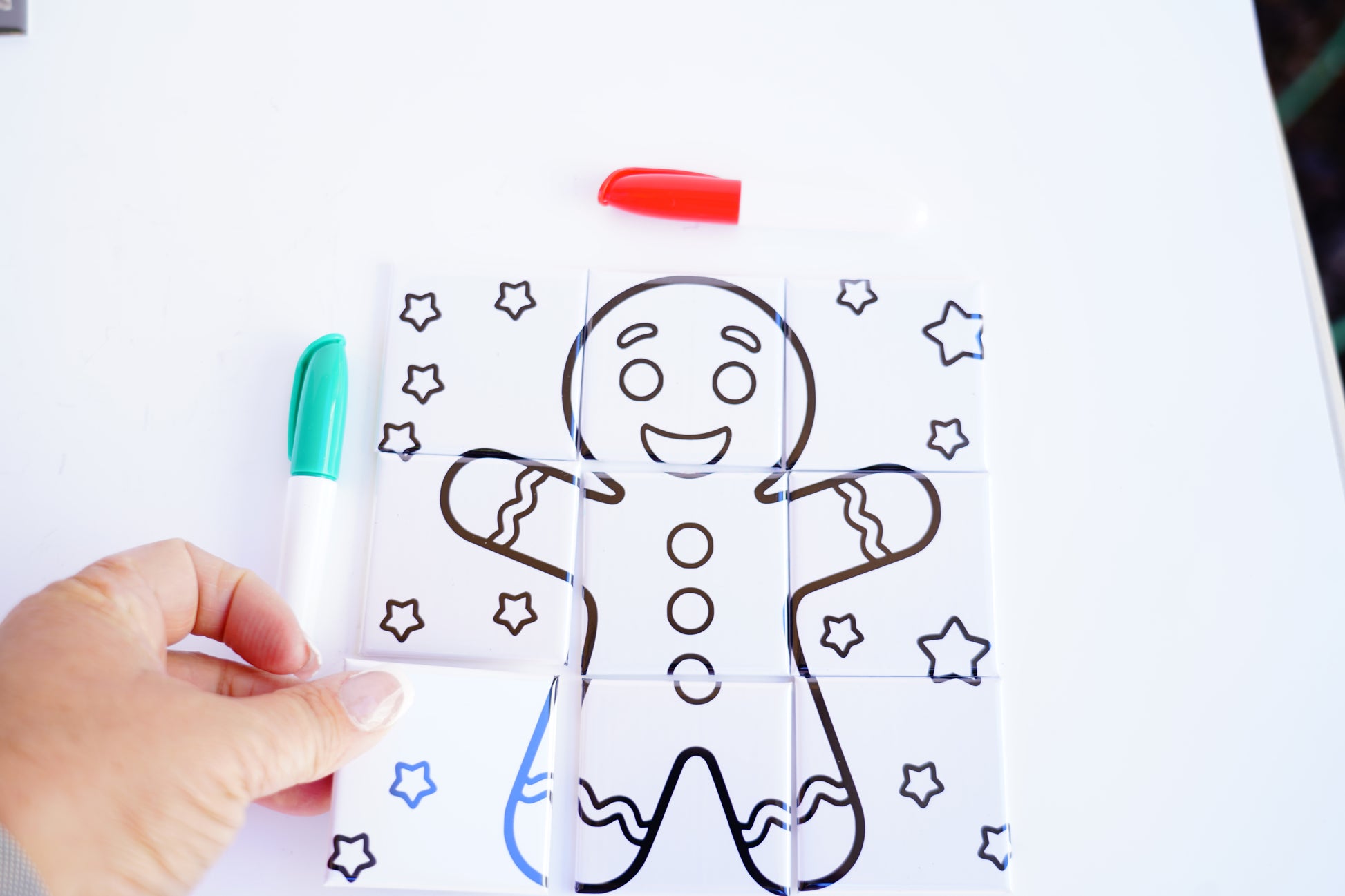 Child coloring gingerbread dry erase puzzle magnet